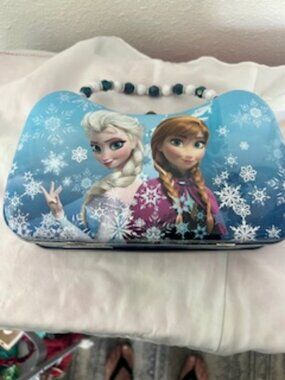 Disney's Frozen Elsa's & Anna's Tin Bin -Blue with White Beaded strap